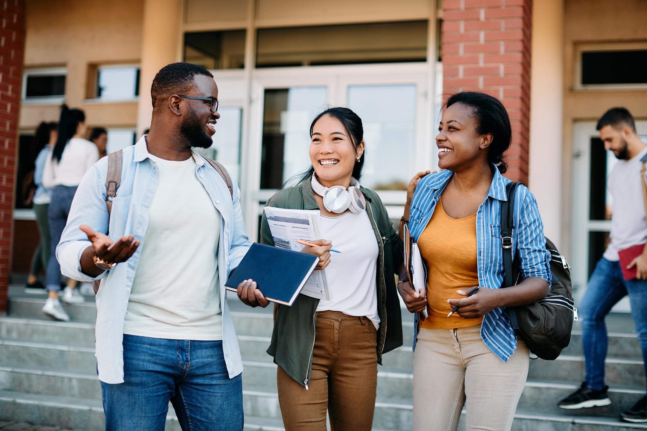 Three Students walking and talking